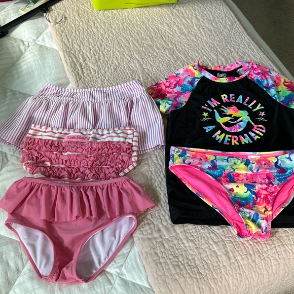 Ruffle Butts Other - 3 bikini bottoms and one bikini and swim shirt. These are all sold as a set